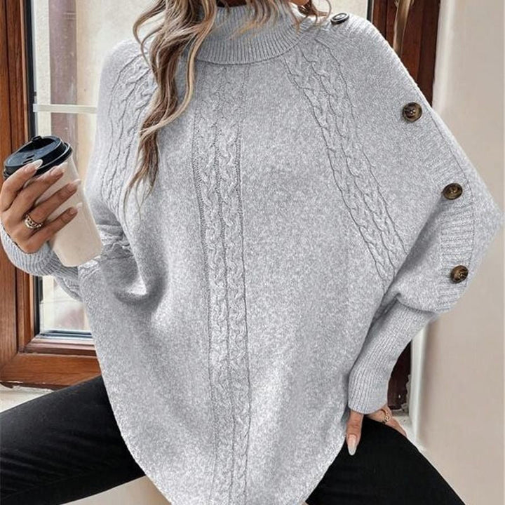 Gudrun grå ponchotröja med flätstickning