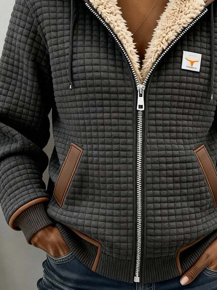 Sancha | Sherpa-fodrad quiltad zip-up huva jacka